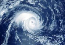 Hurricane swirling over the ocean from above