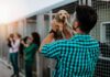 Man holding a puppy at an animal shelter