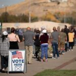 voters standing in a long line outside a polling place