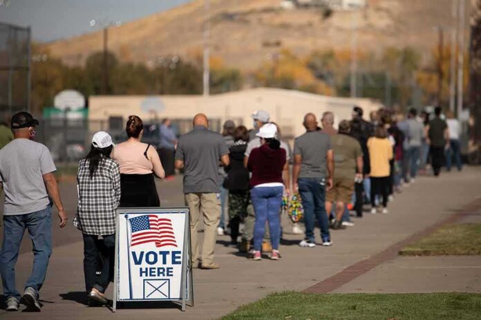 voters standing in a long line outside a polling place