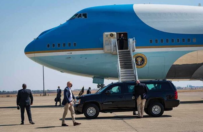 shutterstock_2047086128-2 Security detail near blue and white aircraft with staircase and SUV