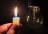 candle flame held near an unlit light bulb