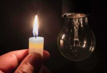 candle flame held near an unlit light bulb