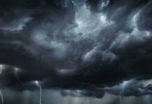 Dark storm clouds with multiple lightning bolts