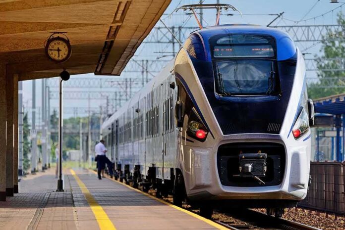 Modern passenger train arriving at a station platform