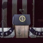 Presidential podium with microphones and teleprompters