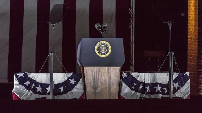 Presidential podium with microphones and teleprompters