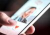 hand using a dating app on a smartphone