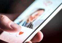 hand using a dating app on a smartphone