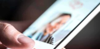hand using a dating app on a smartphone