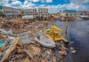 Coastal town marina destroyed by storm with debris and damaged boats