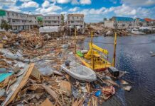 Coastal town marina destroyed by storm with debris and damaged boats