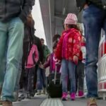 Crowd walking on a train platform