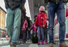 Crowd walking on a train platform