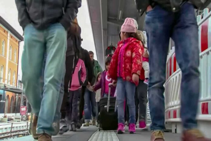 Crowd walking on a train platform