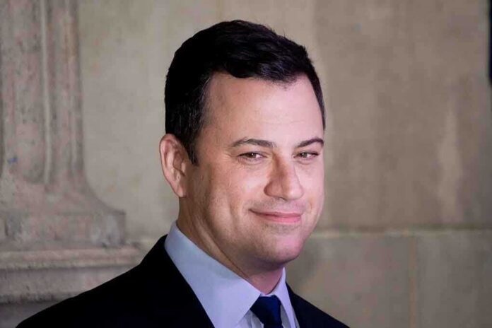 Jimmy Kimmel in a suit smiling at an event