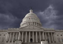 United States Capitol building under stormy skies