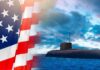 Submarine at sea beside a partial American flag