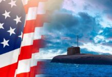 Submarine at sea beside a partial American flag