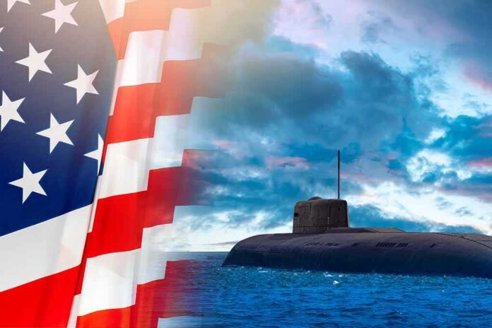 Submarine at sea beside a partial American flag