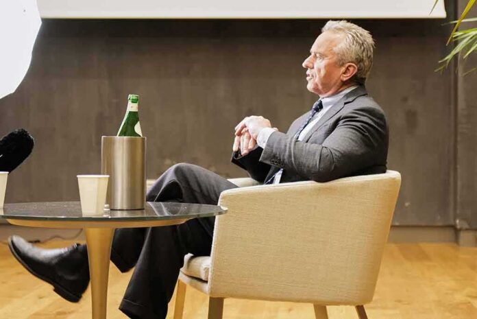 Robert F. Kennedy Jr. seated in a chair during an interview or talk