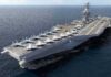 Aircraft carrier at sea with fighter jets on deck